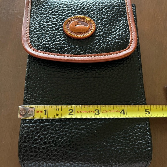 Dooney & Bourke Black and Brown Crossbody Bag.
I am not sure if a true Dooney. - Picture 2 of 5